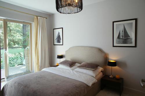 Llit o llits en una habitació de Apartament Rezydencja Bryza Jurata