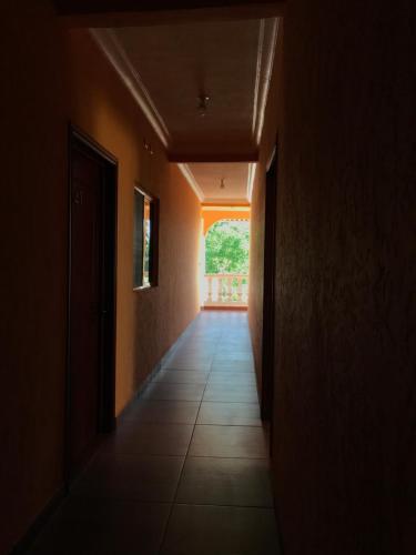 an empty hallway with a hallway leading to a door at Hotel Campo Real Plus Tamasopo in Tamasopo