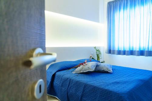 Postel nebo postele na pokoji v ubytování Residence Nonna Mariuccia