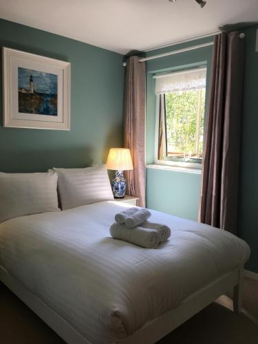 a bedroom with a bed with towels on it at Edinburgh Old Town in Edinburgh