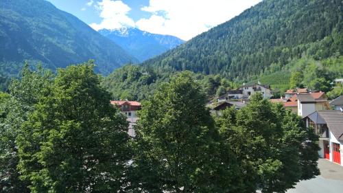 a town in a valley with mountains in the background at Hotel Krone in Morter