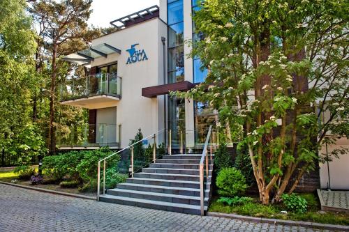 a building with stairs in front of it at Villa Aqua BlueApart Jurata in Jurata