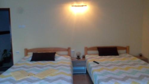 Katil atau katil-katil dalam bilik di Djurdja Apartment