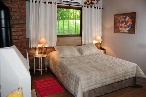 Ένα ή περισσότερα κρεβάτια σε δωμάτιο στο Hotel Daniela