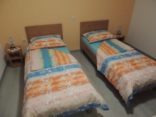 a room with two beds in a room at Apartments Palma in Labin