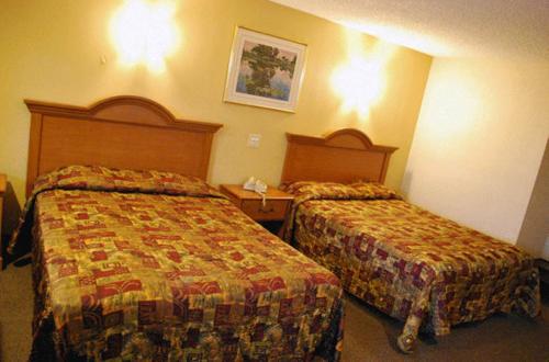 Ένα ή περισσότερα κρεβάτια σε δωμάτιο στο South Bay Motel
