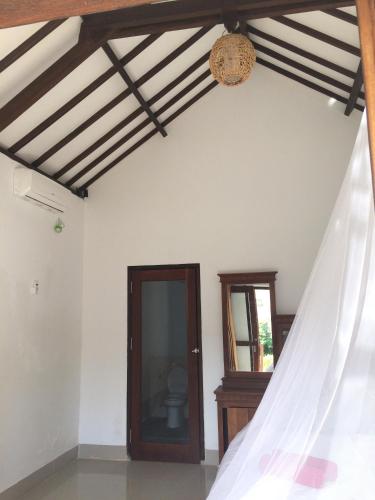 Postel nebo postele na pokoji v ubytování Gili Beach