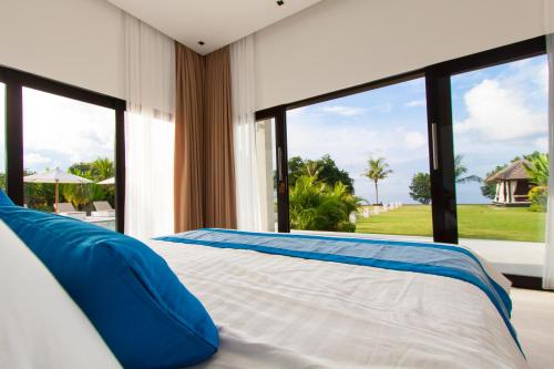 Un pat sau paturi într-o cameră la Villa Mathan