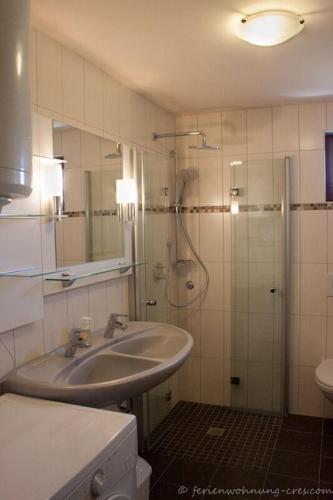 a bathroom with a sink and a shower at Cres in Cres