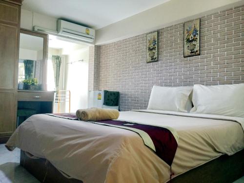 Llit o llits en una habitació de Jang Sripoom House