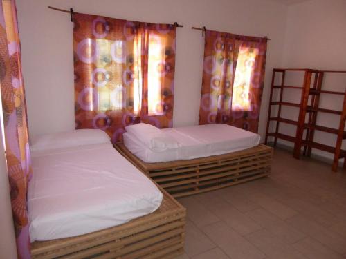 Cama o camas de una habitación en Sarawally Guesthouse