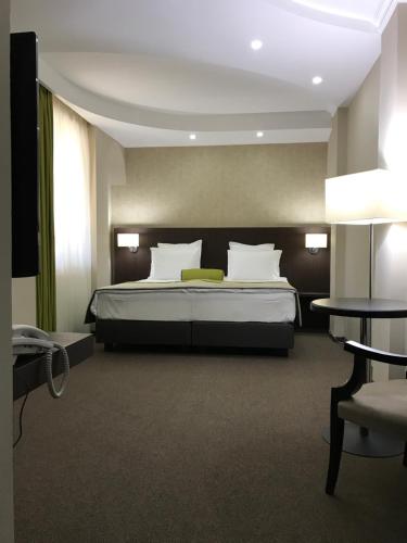 Кровать или кровати в номере Hotel Alex