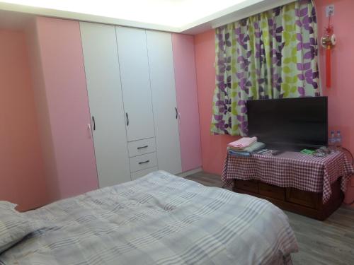 Una cama o camas en una habitación de Lai Yi Ke B&B