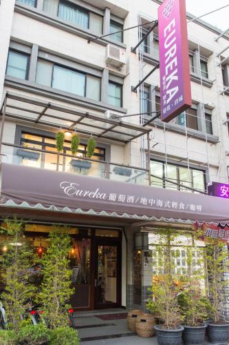 a building with a sign in front of it at Eureka in Tainan
