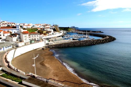 a view of a beach with boats in the water at Villa Atlantica Apartments in Angra do Heroísmo