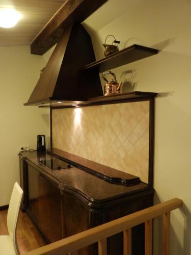 a large aquarium in a room with a stove at Helsinkis in Anykščiai