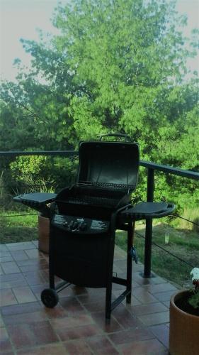a chair sitting on a patio with a table at Farallones de Sutatausa El Rincón in Sutatausa