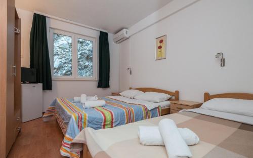 Postel nebo postele na pokoji v ubytování Motel Jadranka
