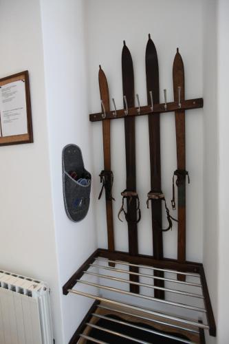 a rack of skis hanging on a wall at Apartment Gondola in Maribor