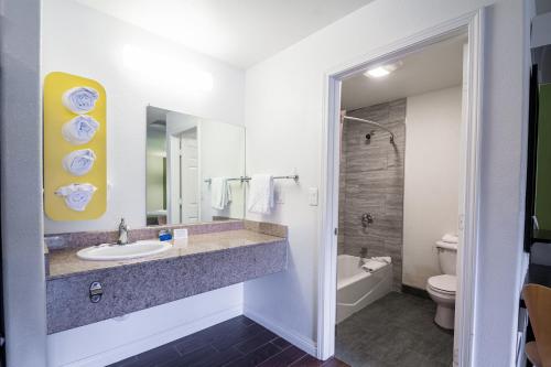 a bathroom with a sink and a toilet at Fisherman's Cove Inn in Monterey