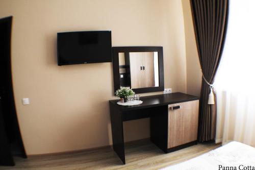 TV a/nebo společenská místnost v ubytování AMIGO Panna-Cotta
