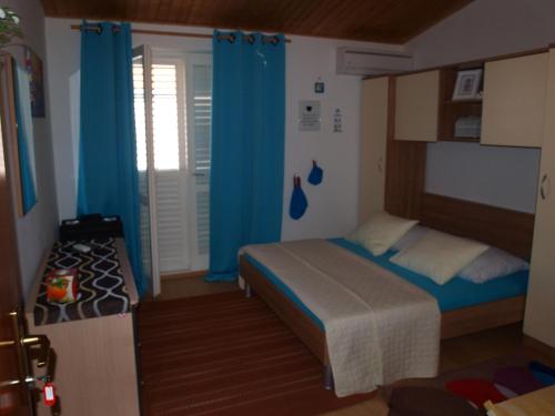 Postel nebo postele na pokoji v ubytování Apartment Duje