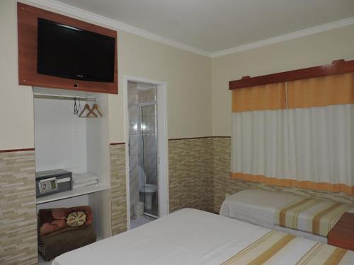 Ένα ή περισσότερα κρεβάτια σε δωμάτιο στο Hotel Brooklin