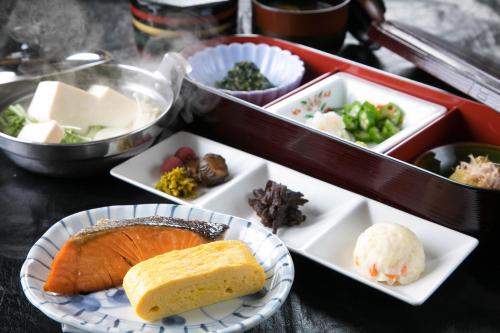 a tray of food with different types of food at Ryokan Seishounagon in Tsu