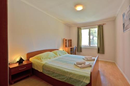 Posteľ alebo postele v izbe v ubytovaní Riva1 Apartments and Rooms