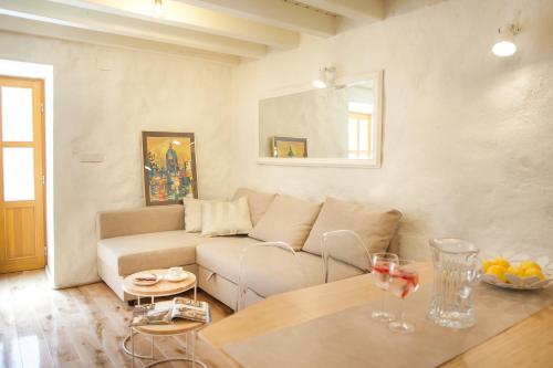 a living room with a couch and a table at Apartman Brunela-free parking in Šibenik