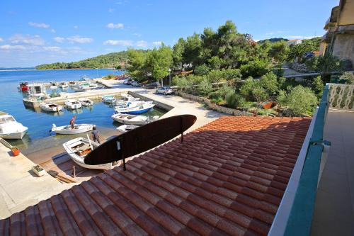 a view of a marina with boats in the water at Apartment and rooms Roko in Zaglav