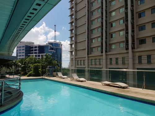 a swimming pool in the middle of a building at Cebu Parklane International Hotel in Cebu City