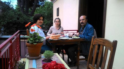 a group of three people sitting at a table at Elaia Hotel in Bergama
