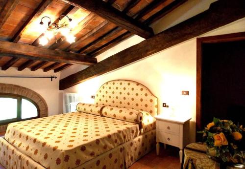 a bedroom with a bed in a room at Tenuta Poggio Marino in Dicomano