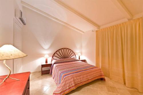Giường trong phòng chung tại Il Fiordo con favolosa vista mare