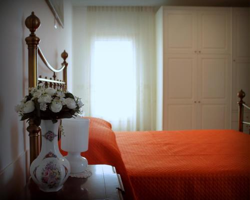 Postel nebo postele na pokoji v ubytování B&B L'Ulivo