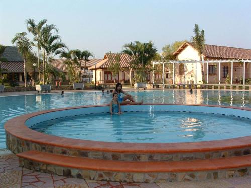 a woman and a child in a pool at a resort at Can Gio Resort in Cần Giờ