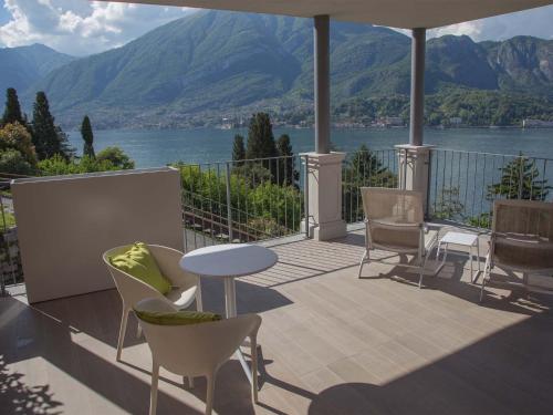 a balcony with a view of a lake and mountains at Borgo Le Terrazze in Bellagio