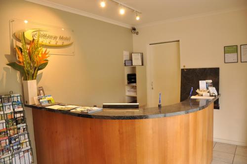 a large kitchen with a large counter top at Chittaway Motel in Tuggerah