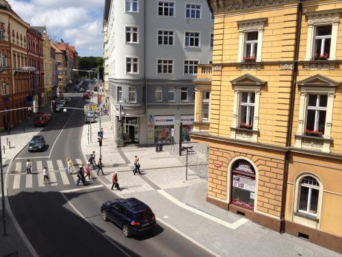 a view of a city street with a car on the road at Penzion u Vlčků in Cheb