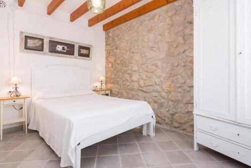 Postel nebo postele na pokoji v ubytování Sa Casa De Ses Bicicletes