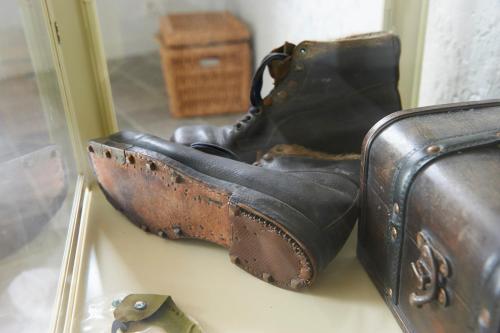 a pair of black boots sitting next to a suitcase at B&B Barvaux, Durbuy in Durbuy