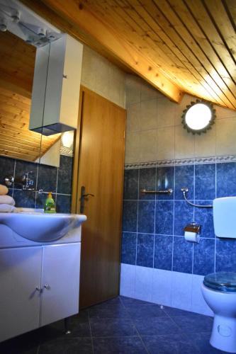 a bathroom with a sink and a toilet at Apartments Bakuk in Stari Grad