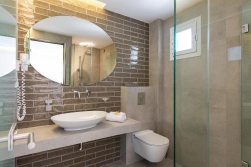 A bathroom at Akti Belvedere Color & Essence
