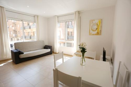 Posteľ alebo postele v izbe v ubytovaní Apartaments Claudia