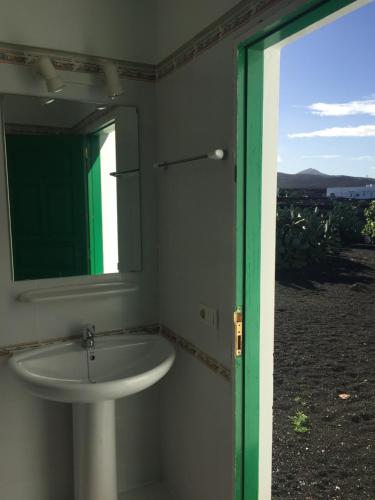 a bathroom with a sink and a mirror at Casa Andrés in Yaiza