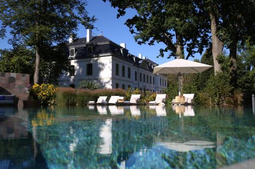 The swimming pool at or close to Weissenhaus Private Nature Luxury Resort