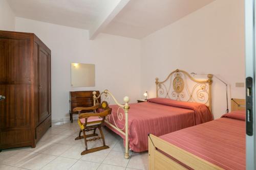 Ένα ή περισσότερα κρεβάτια σε δωμάτιο στο Agriturismo Case Nuove