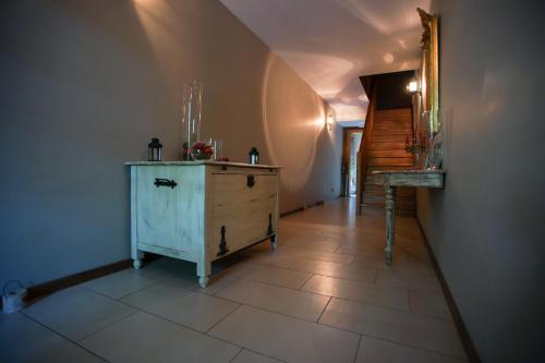 a hallway with a wooden dresser in a room at Guest house Western-city in Chaudfontaine