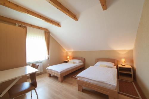 Ένα ή περισσότερα κρεβάτια σε δωμάτιο στο Guest House Bruna